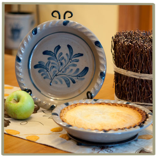 Rowe Pottery handmade stoneware pie plate shown with a beautiful apple pie