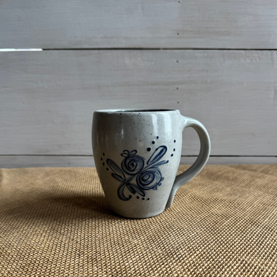 Rowe Pottery Hand thrown stoneware mug In a hand decorated Artist choice floral pattern