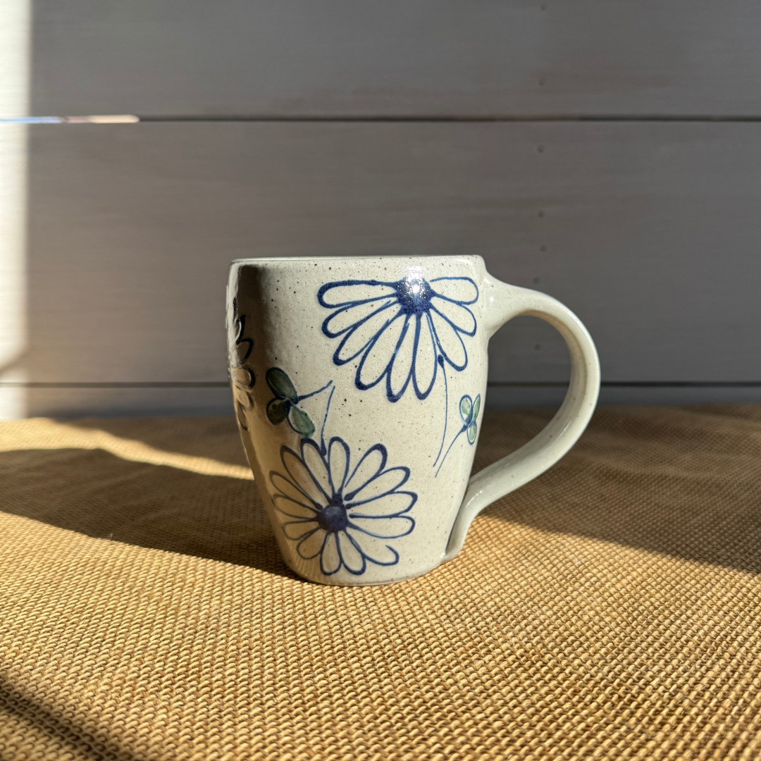 Rowe Pottery Hand thrown stoneware mug In a hand decorated Daisy pattern