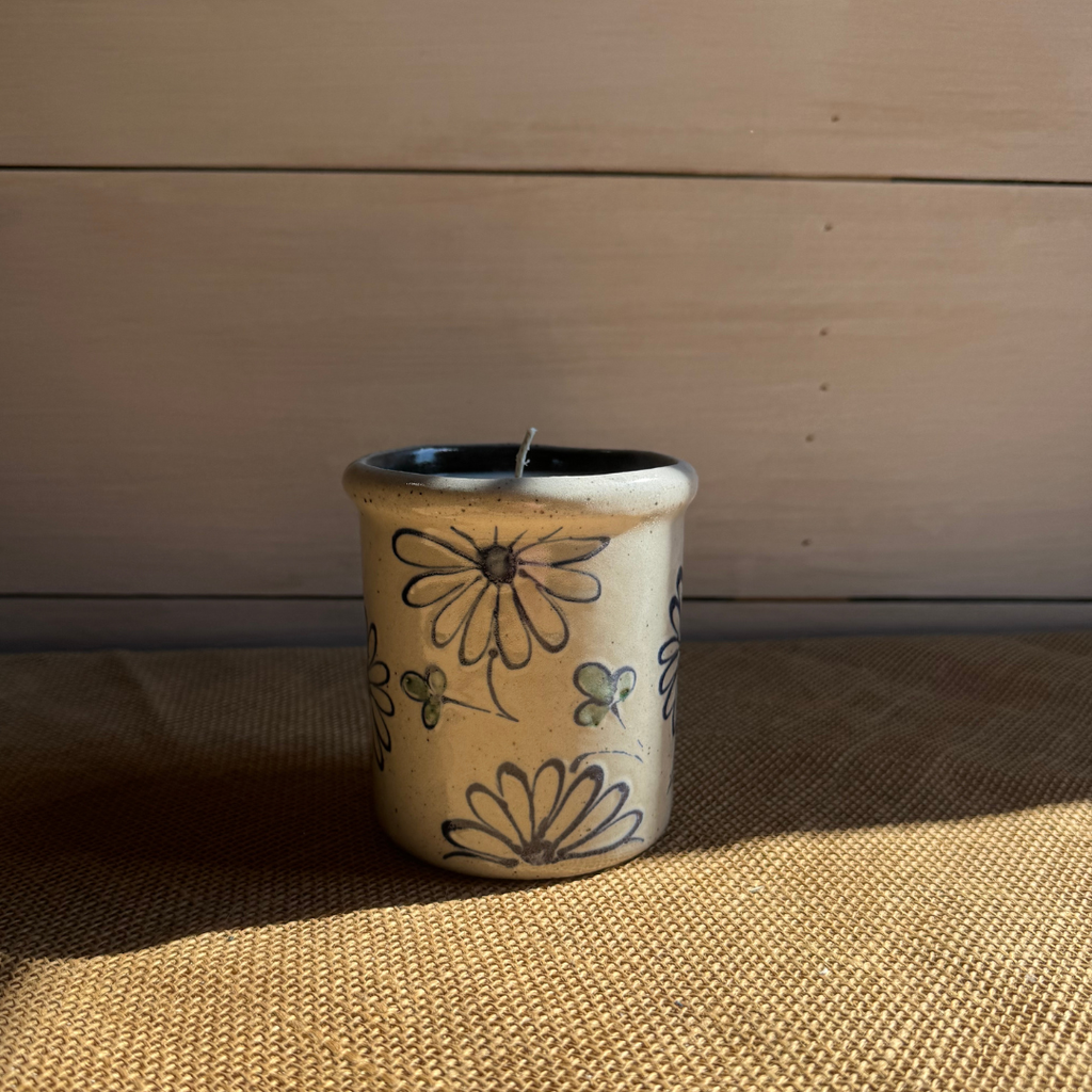 Rowe Pottery handmade stoneware candle crock in a hand decorated daisy pattern