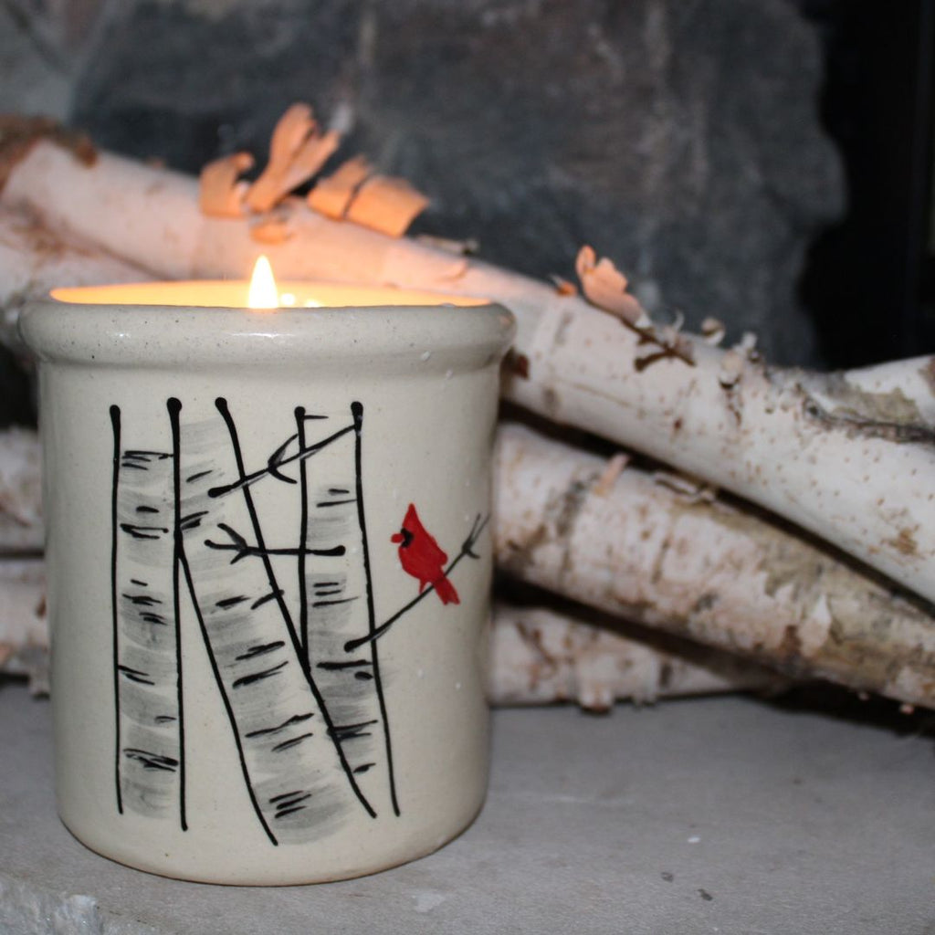 Rowe Pottery handmade stoneware candle crock in a hand decorated winter birch pattern with sticks background