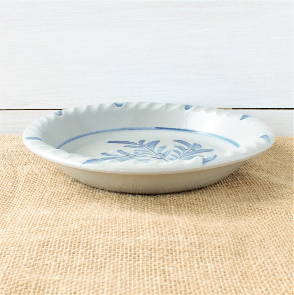 Rowe Pottery handmade stoneware pie plate with Teaberry pattern low angle view