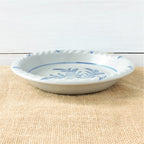 Rowe Pottery handmade stoneware pie plate with Teaberry pattern low angle view
