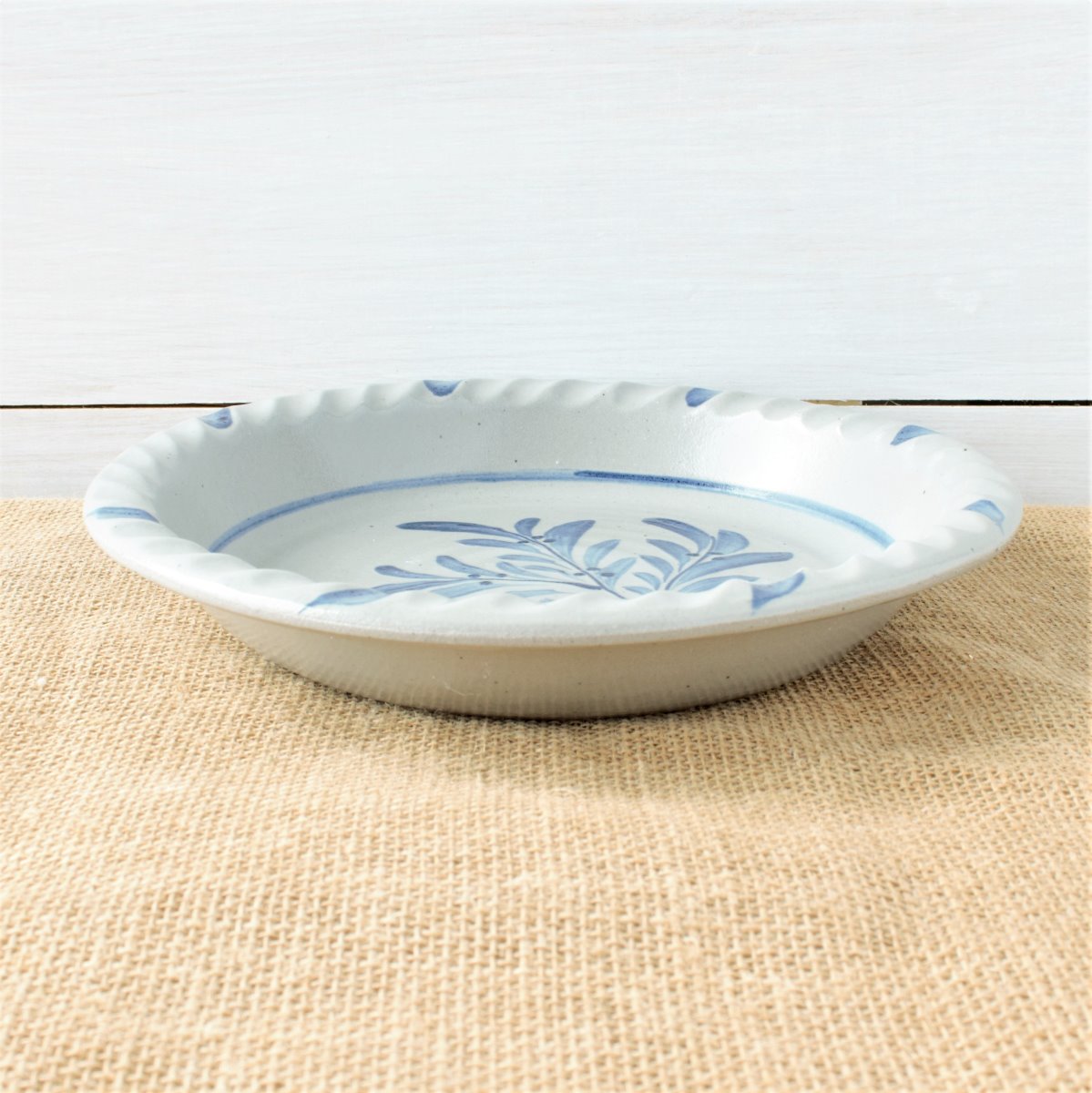 Rowe Pottery handmade stoneware pie plate with Teaberry pattern low angle view