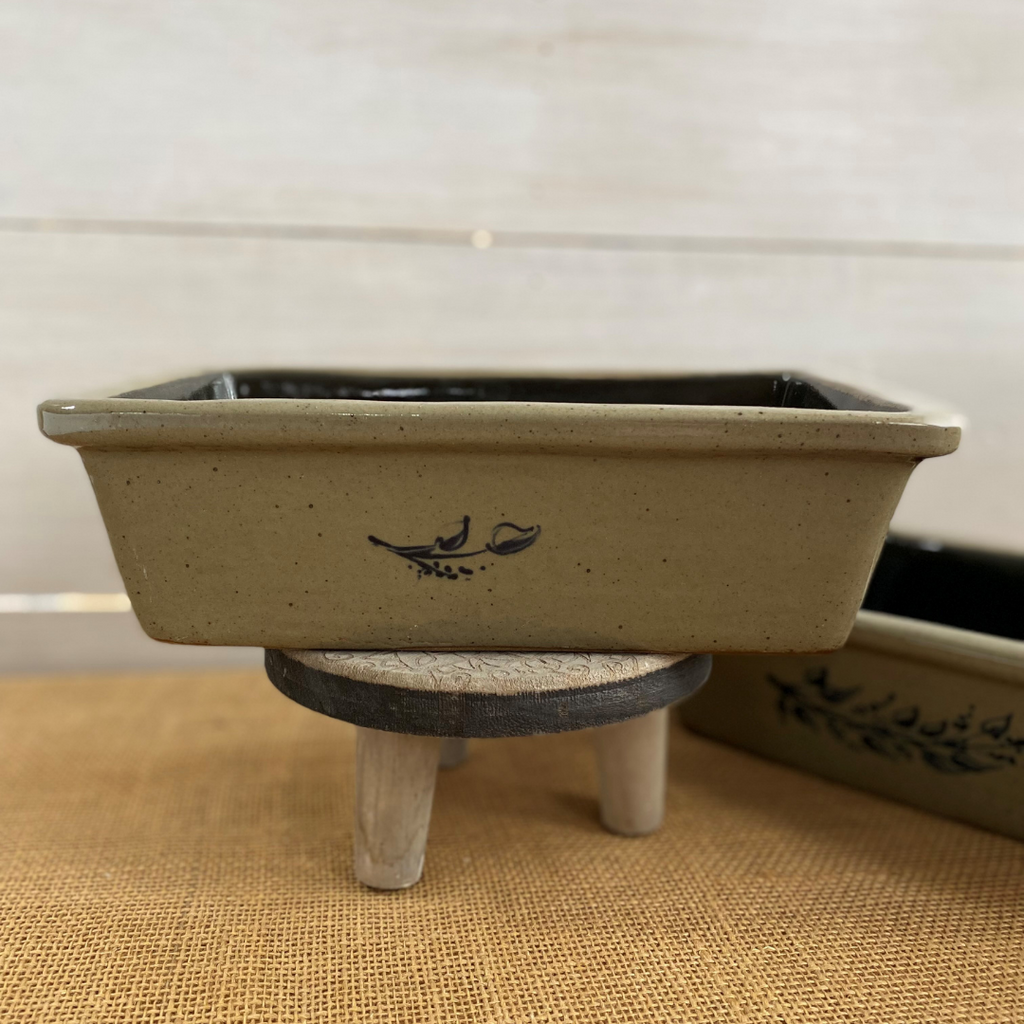 Rowe Pottery handmade stoneware bread baker with farm floral pattern and a warm mocha glaze side view