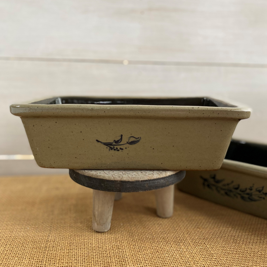 Rowe Pottery handmade stoneware bread baker with farm floral pattern and a warm mocha glaze side view