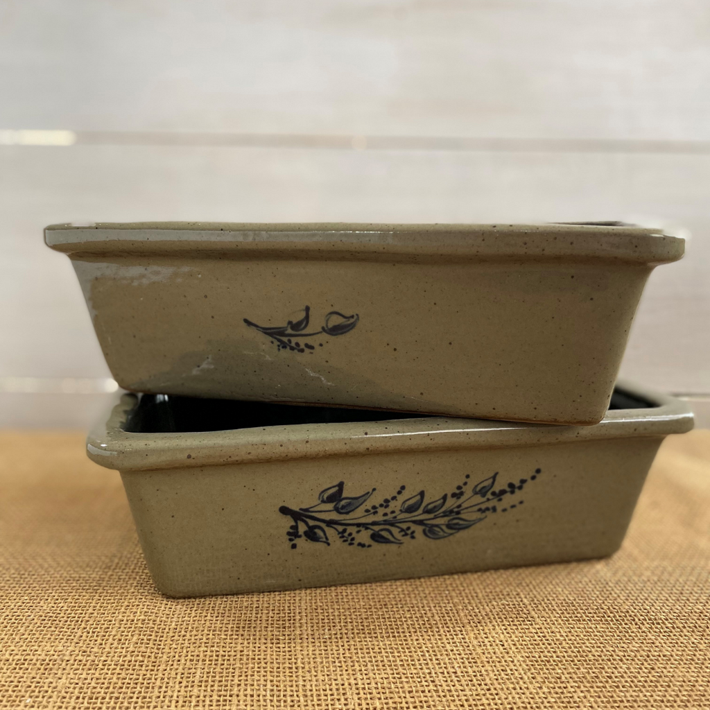 Rowe Pottery handmade stoneware bread baker with farm floral pattern and a warm mocha glaze stacked