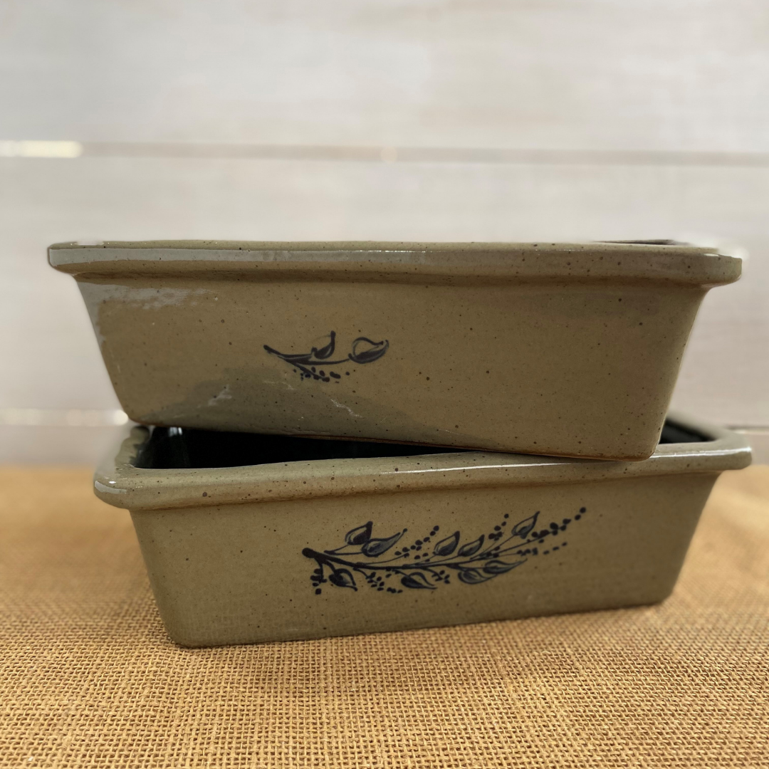 Rowe Pottery handmade stoneware bread baker with farm floral pattern and a warm mocha glaze stacked