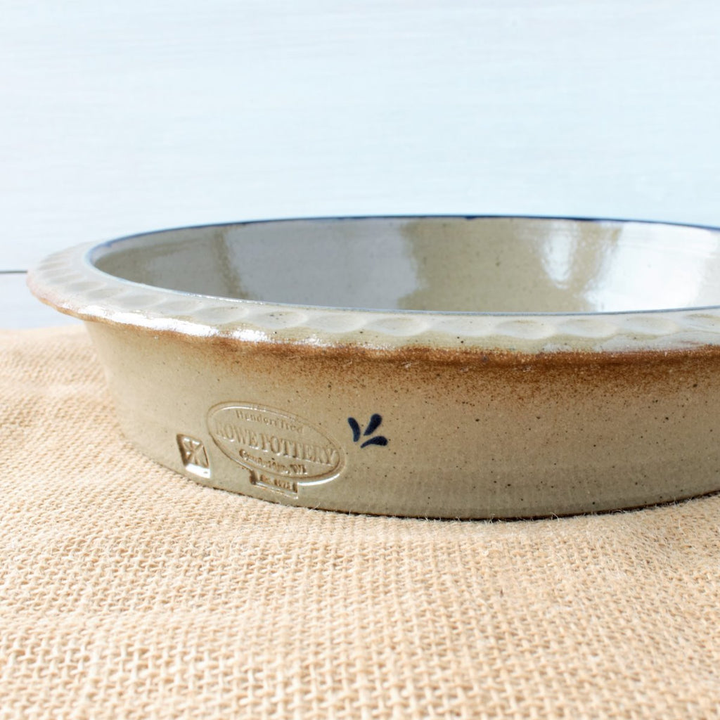 Rowe Pottery handmade stoneware deep dish pie plate with Farm Floral pattern low angle view