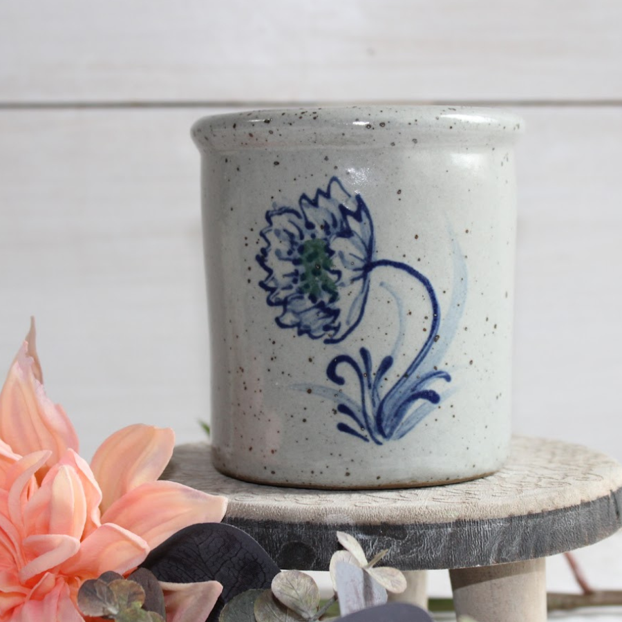 Rowe Pottery handmade stoneware candle crock in a hand decorated Dhalia pattern decorative background