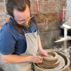 Rowe Pottery potter Jake throwing on the potters wheel