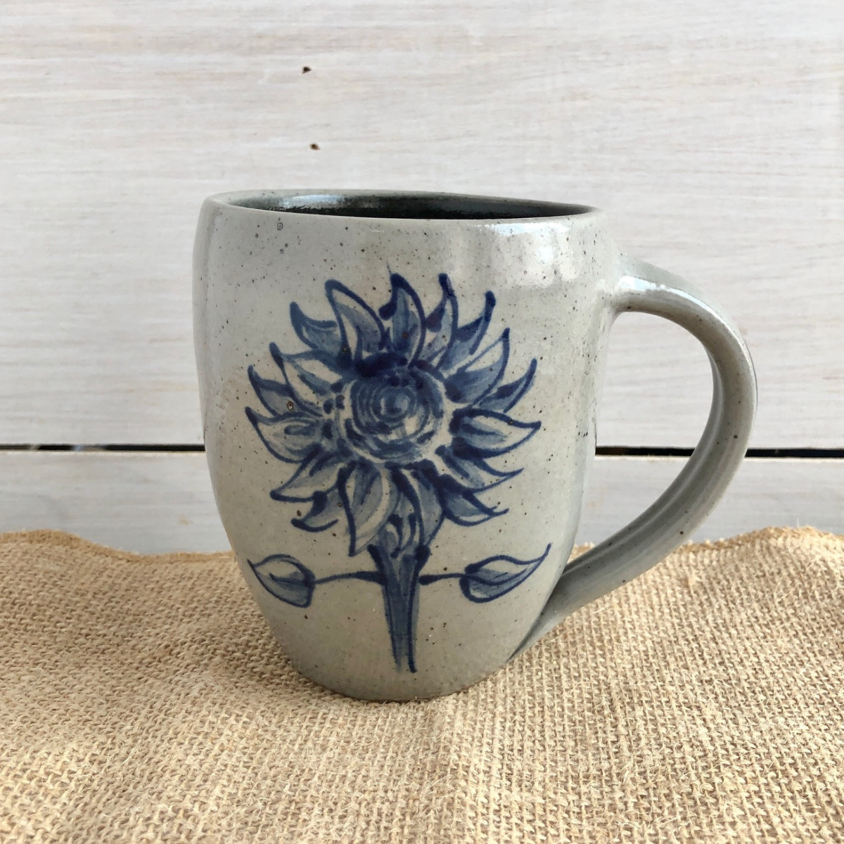 Rowe Pottery Hand thrown stoneware mug In a hand decorated sunflower pattern