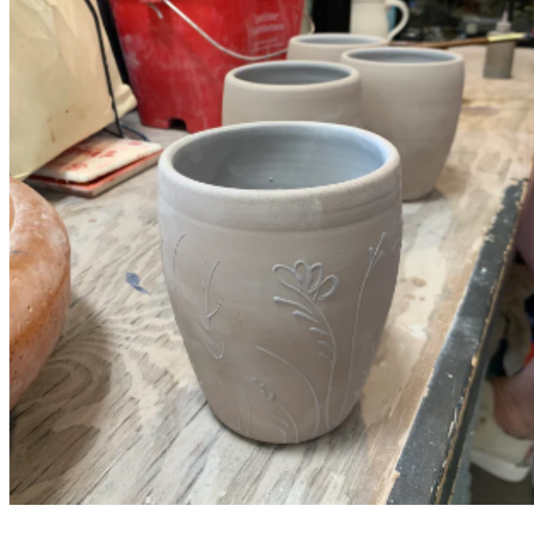 Rowe Pottery Hand thrown stoneware mug In a hand decorated wildflower pattern greenware