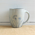 Rowe Pottery Hand thrown stoneware mug In a hand decorated wildflower pattern